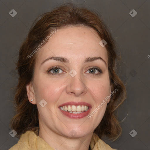 Joyful white adult female with long  brown hair and brown eyes