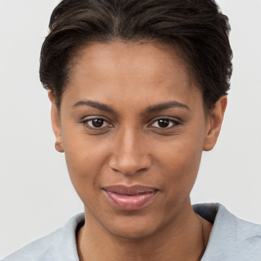 Joyful white young-adult female with short  brown hair and brown eyes