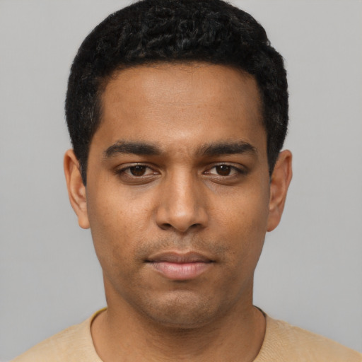 Neutral black young-adult male with short  black hair and brown eyes