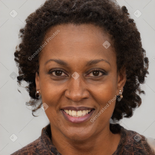 Joyful black adult female with medium  brown hair and brown eyes