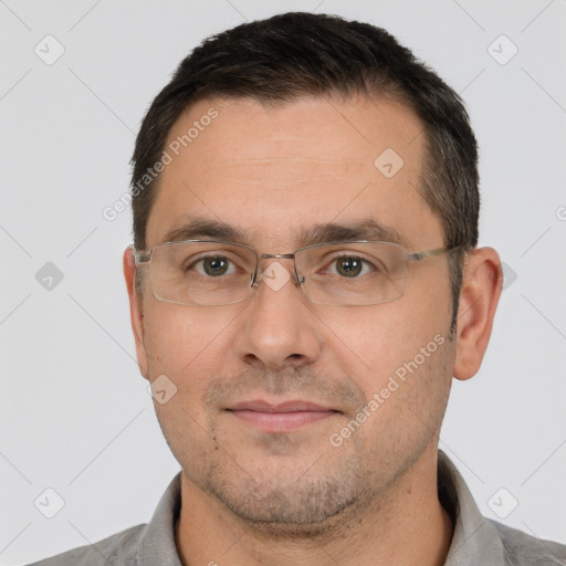 Joyful white adult male with short  brown hair and brown eyes