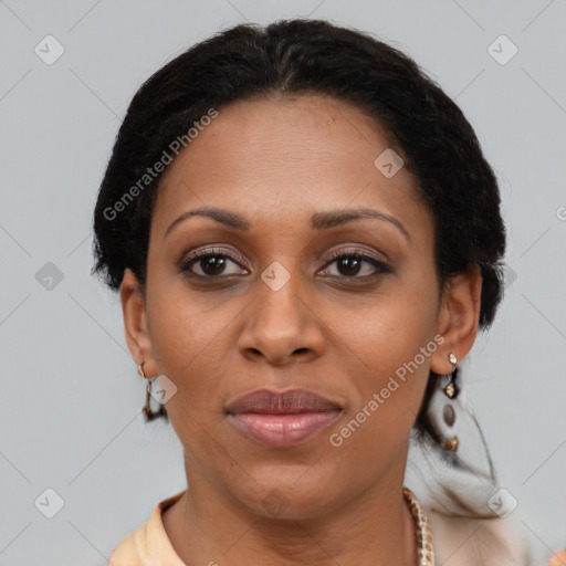 Joyful black adult female with short  brown hair and brown eyes