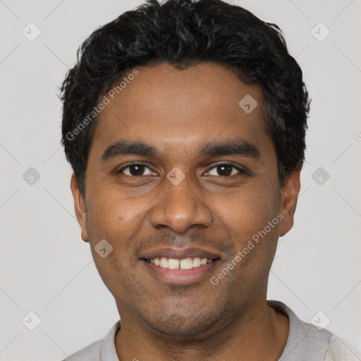 Joyful black young-adult male with short  black hair and brown eyes