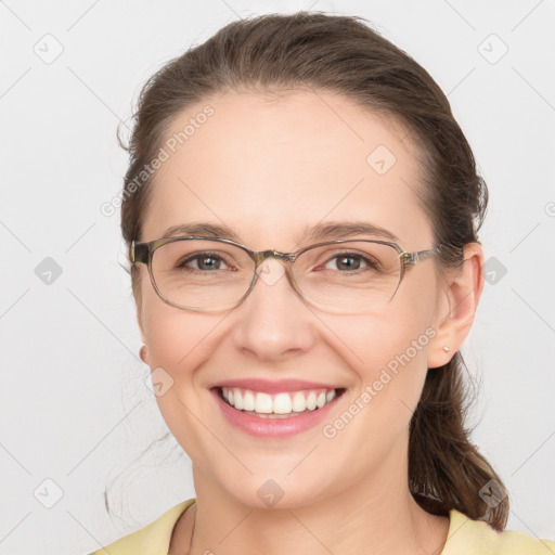 Joyful white adult female with medium  brown hair and grey eyes