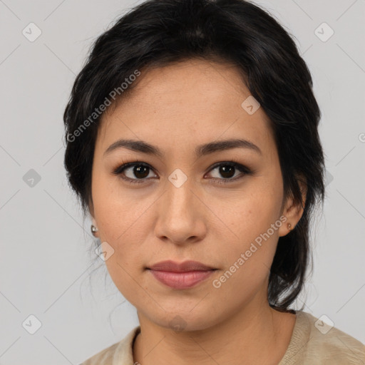 Joyful latino young-adult female with medium  brown hair and brown eyes