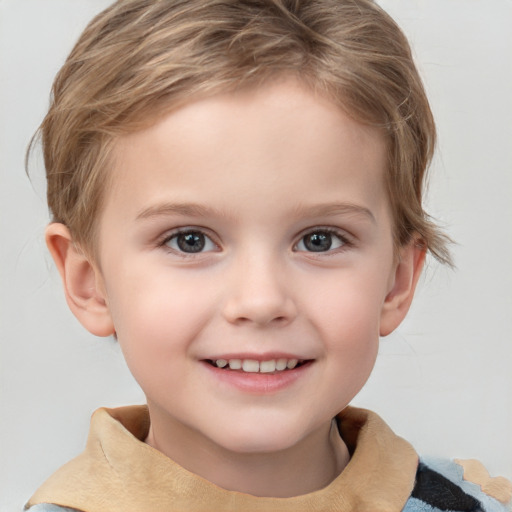 Joyful white child male with short  brown hair and grey eyes