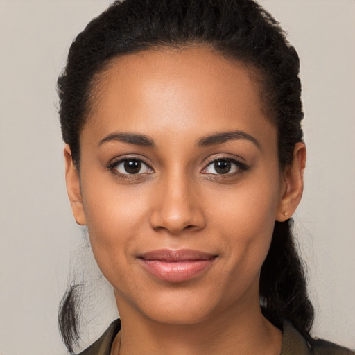 Joyful latino young-adult female with long  brown hair and brown eyes