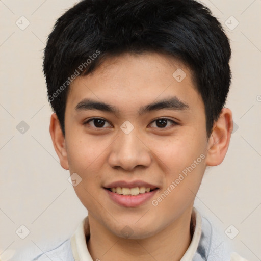 Joyful asian young-adult male with short  black hair and brown eyes
