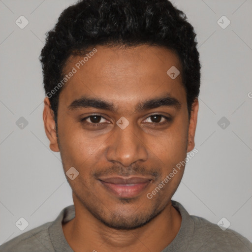 Joyful black young-adult male with short  black hair and brown eyes