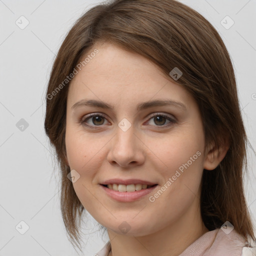 Joyful white young-adult female with medium  brown hair and grey eyes