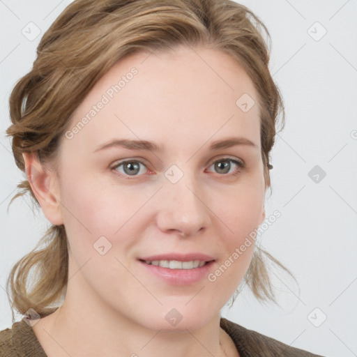 Joyful white young-adult female with medium  brown hair and blue eyes