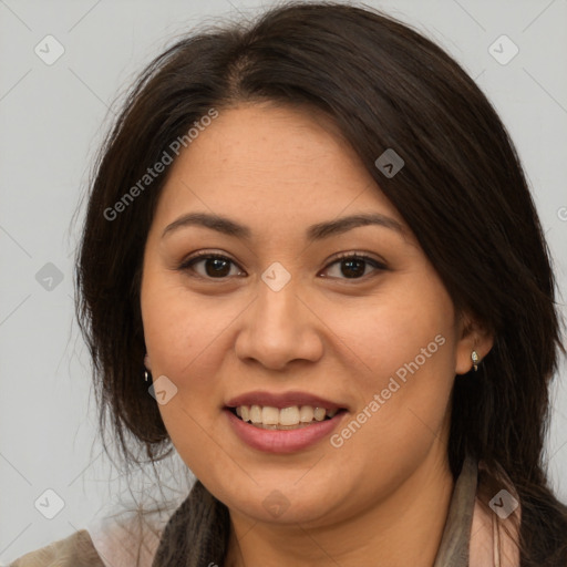 Joyful latino young-adult female with long  brown hair and brown eyes