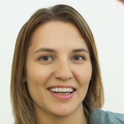 Joyful white young-adult female with long  brown hair and green eyes