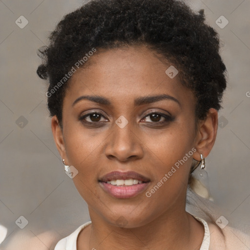 Joyful black young-adult female with short  brown hair and brown eyes