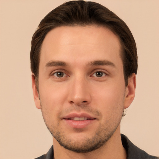 Joyful white young-adult male with short  brown hair and brown eyes