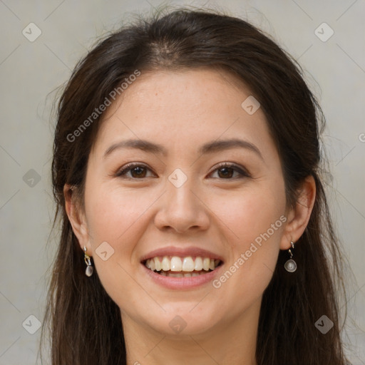 Joyful white young-adult female with long  brown hair and brown eyes