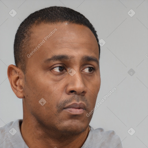 Neutral black young-adult male with short  brown hair and brown eyes