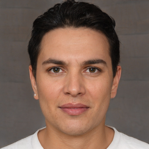 Joyful white young-adult male with short  brown hair and brown eyes