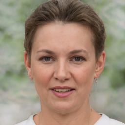 Joyful white adult female with short  brown hair and brown eyes