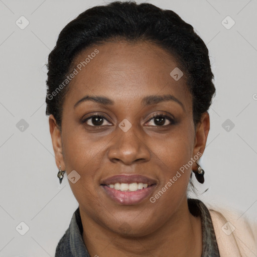 Joyful black young-adult female with short  brown hair and brown eyes