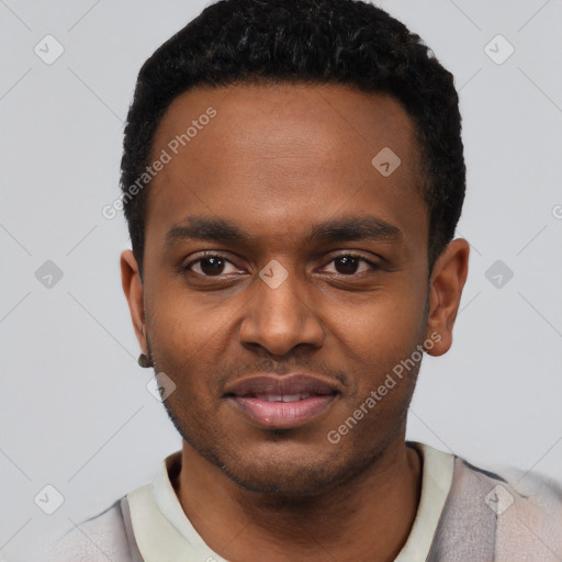 Joyful black young-adult male with short  black hair and brown eyes