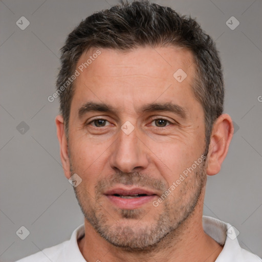 Joyful white adult male with short  brown hair and brown eyes