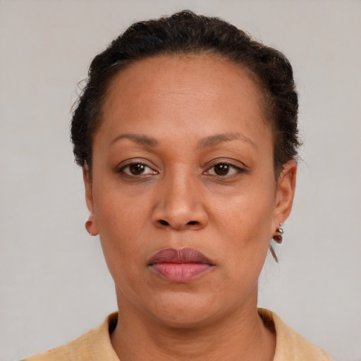 Neutral latino adult female with short  brown hair and brown eyes