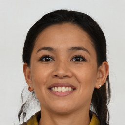 Joyful asian young-adult female with medium  brown hair and brown eyes