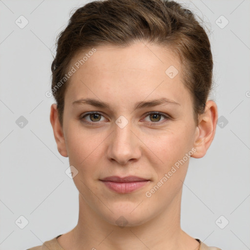 Joyful white young-adult female with short  brown hair and grey eyes