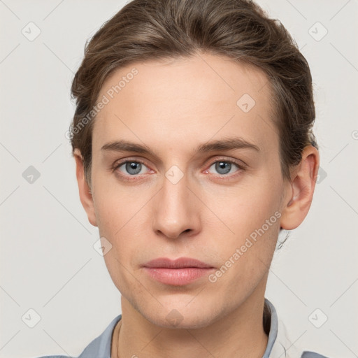 Neutral white young-adult male with short  brown hair and grey eyes