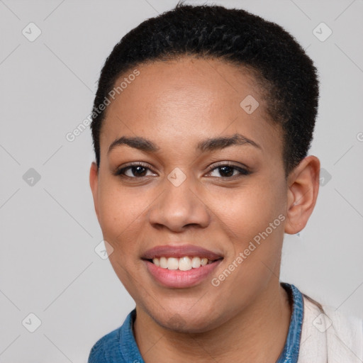 Joyful black young-adult female with short  black hair and brown eyes