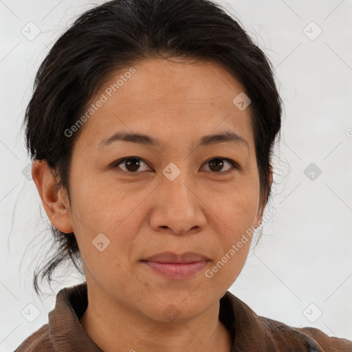 Joyful white adult female with medium  brown hair and brown eyes