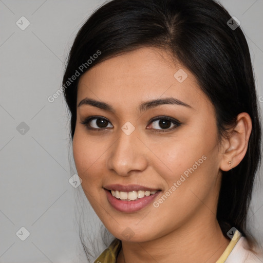 Joyful latino young-adult female with medium  brown hair and brown eyes