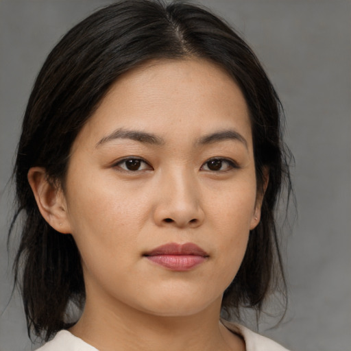 Neutral asian young-adult female with medium  brown hair and brown eyes
