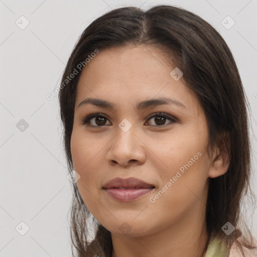 Joyful asian young-adult female with long  brown hair and brown eyes