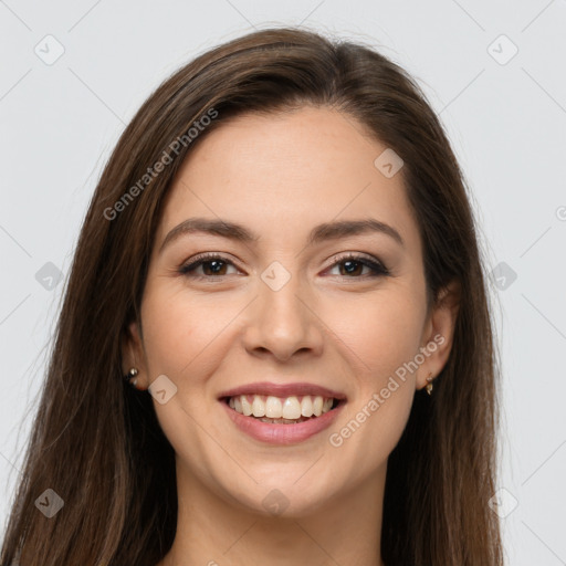 Joyful white young-adult female with long  brown hair and brown eyes