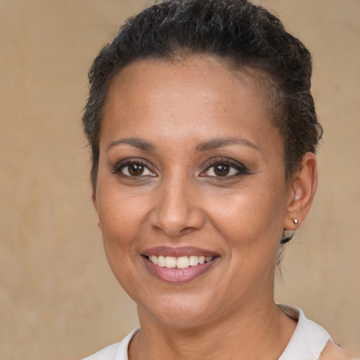 Joyful white adult female with short  brown hair and brown eyes