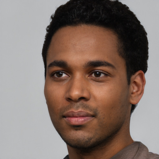 Neutral black young-adult male with short  black hair and brown eyes