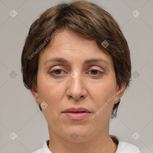 Joyful white adult female with short  brown hair and brown eyes