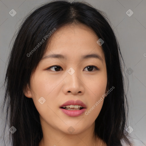 Joyful asian young-adult female with long  black hair and brown eyes