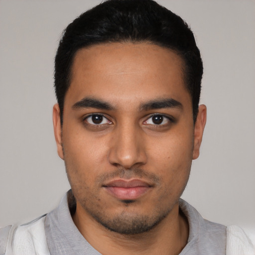 Neutral latino young-adult male with short  black hair and brown eyes