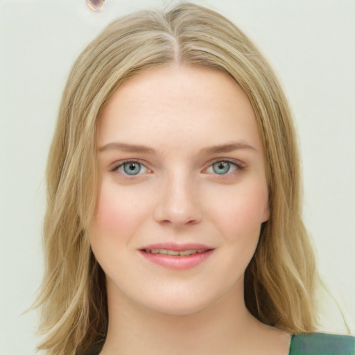 Joyful white young-adult female with long  brown hair and green eyes