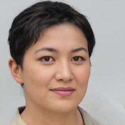 Joyful asian young-adult female with short  brown hair and brown eyes