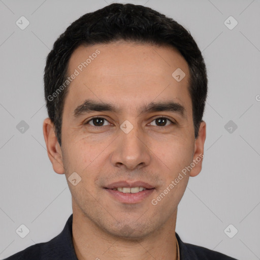 Joyful white young-adult male with short  black hair and brown eyes