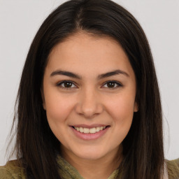 Joyful white young-adult female with long  brown hair and brown eyes