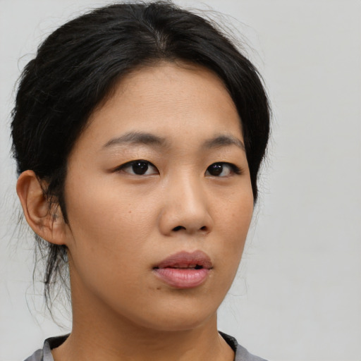Neutral asian young-adult female with medium  black hair and brown eyes
