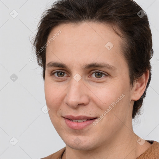 Joyful white adult female with short  brown hair and brown eyes