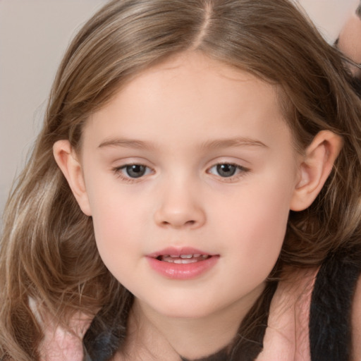 Joyful white child female with medium  brown hair and brown eyes