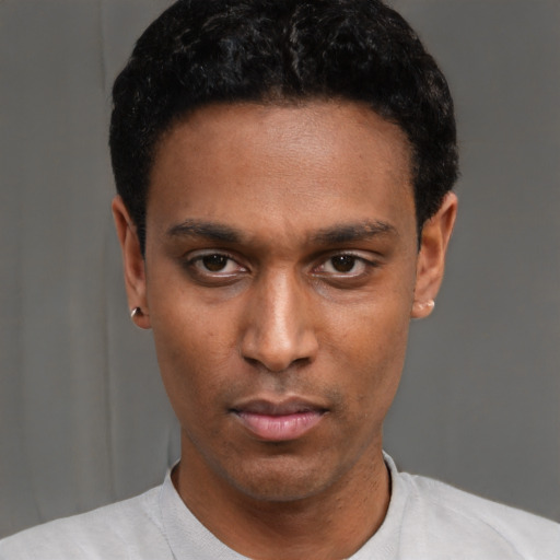 Neutral latino young-adult male with short  black hair and brown eyes
