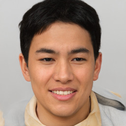 Joyful asian young-adult male with short  brown hair and brown eyes